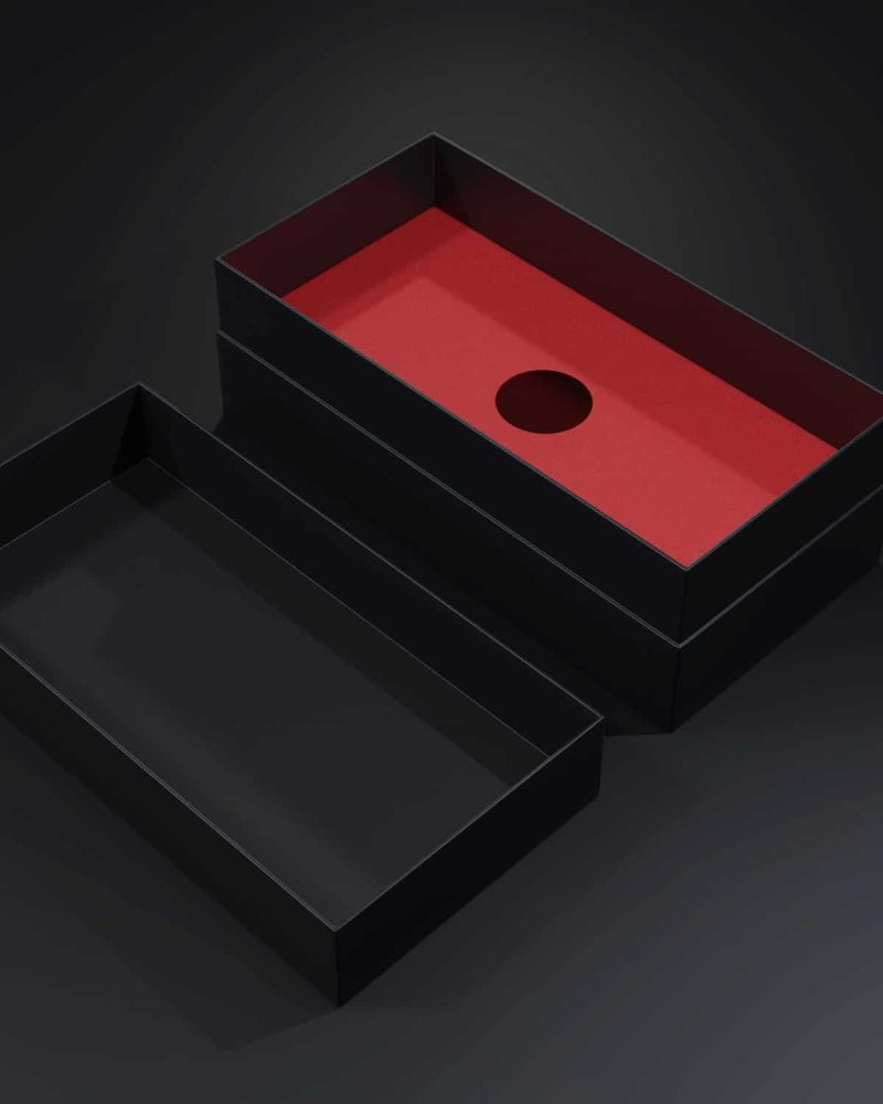 Black blank cardboard box on a dark background. Mock up template.