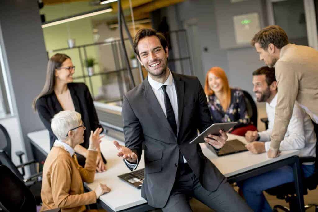 Young businessman using digital tablet in office